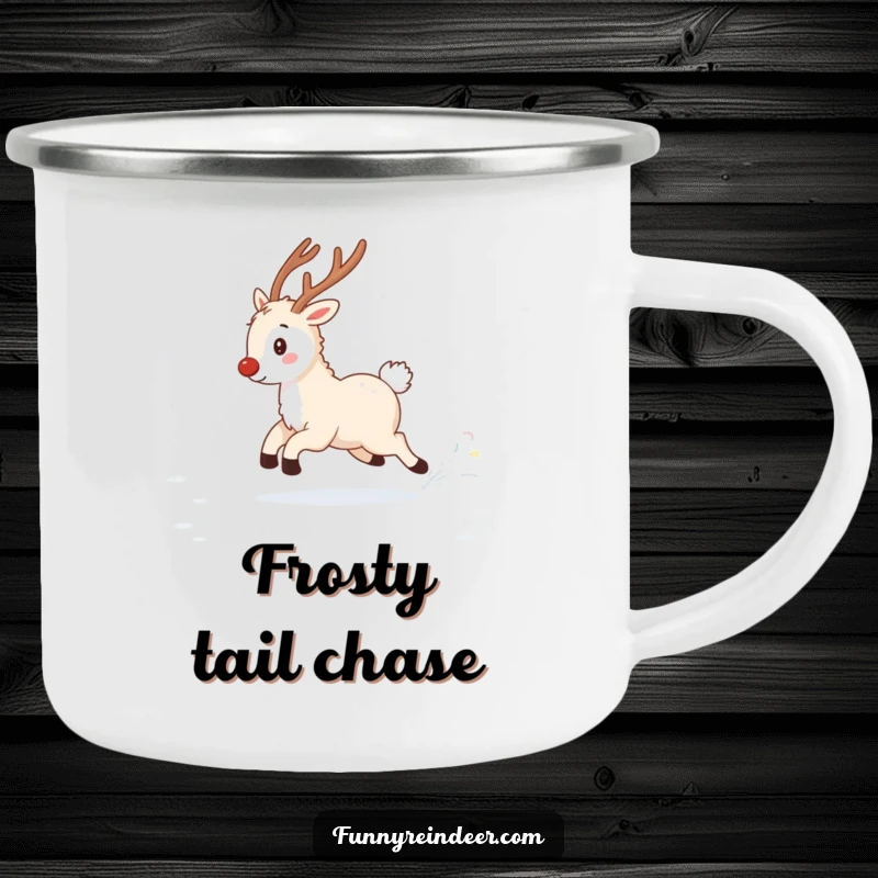 Funny enamel camping mug depicting a fluffy reindeer playfully chasing its twinkling tail in a snowy field, perfect for winter outings.