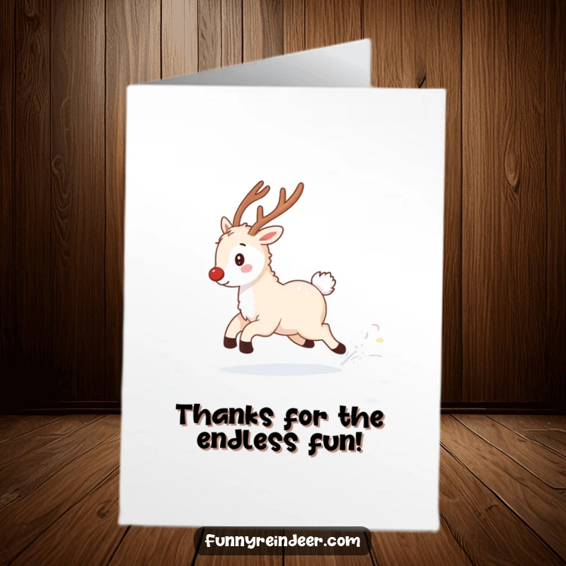 Funny free printable thank you card: A fluffy reindeer playfully chases its twinkling tail, creating a fun snow-filled scene.