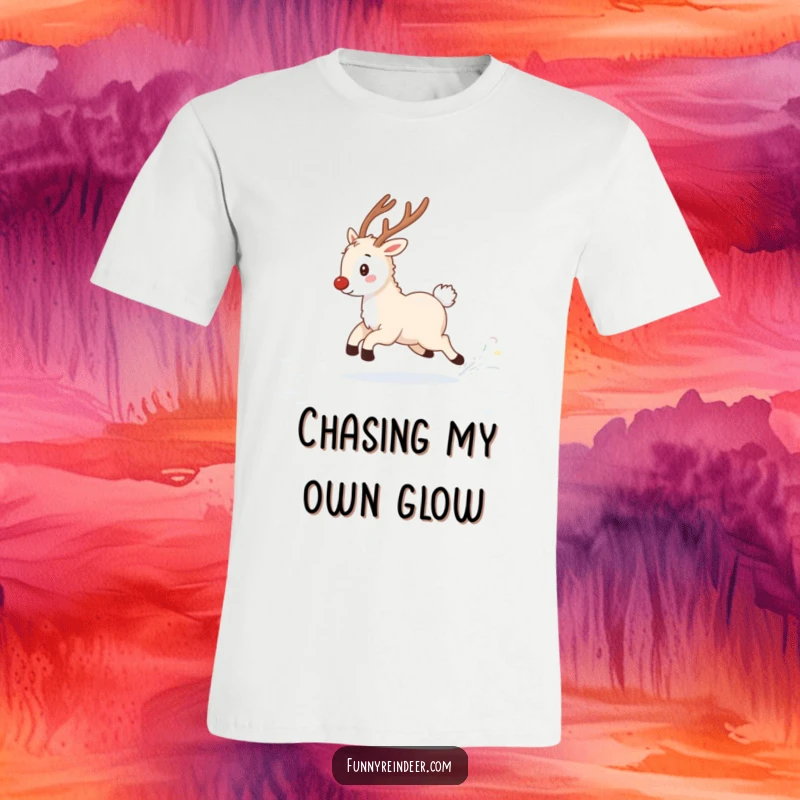 Funny t-shirt showing a fluffy reindeer gleefully chasing its sparkling tail in a snowy landscape, perfect for winter enthusiasts.