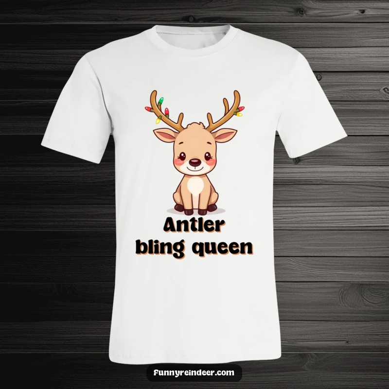 Funny t-shirt depicting a cute reindeer with small antlers sparkling with tiny festive lights, its ears wiggling playfully.